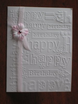 Embossed Happy Birthday with flower ribbon