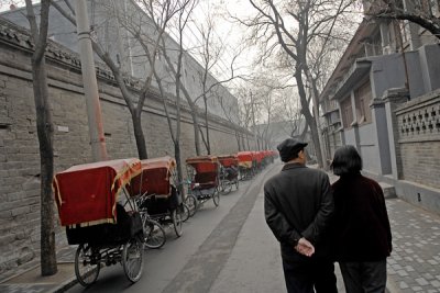 Couple walking a Beijing Hutong