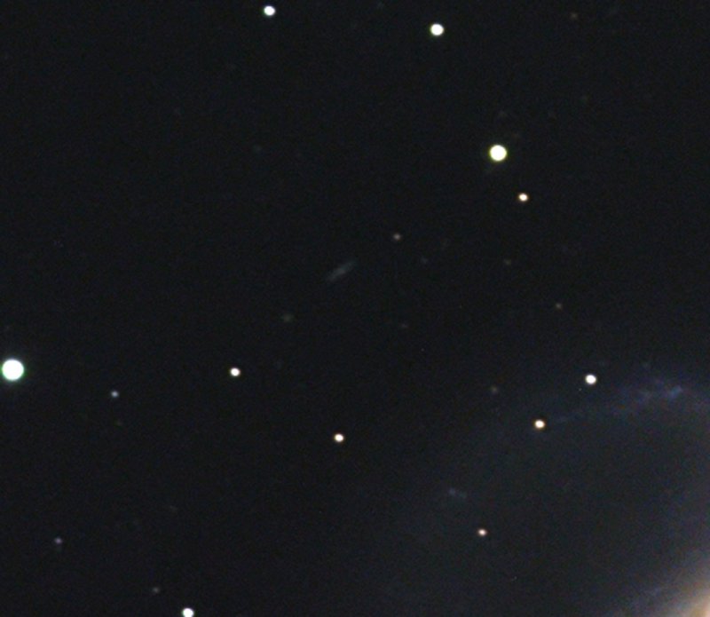 NGC 1097 with distant galaxy