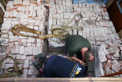 unloading 20 tons of bricks