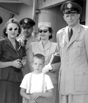 1954: On board Navy transport prior to departure.  Mom (far left), Dad (far right).