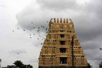 The rain clouds and the birds add to the beauty of Belur