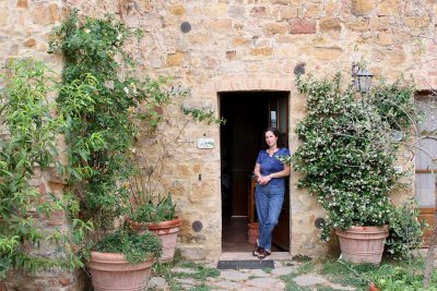 Anita in the doorway of our room at the Agriturismo Cretaiole.jpg