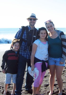 Graham at the beach with his dad, brother, sister, and cousin