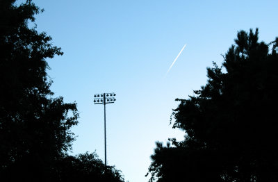 contrail over the high school.jpg