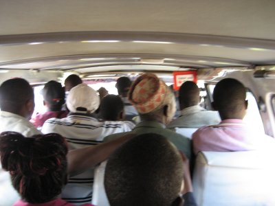 In a crowded matatu, leaving Kisumu.