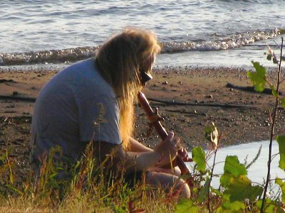Playing his flute along the Mississippi River.jpg(342)
