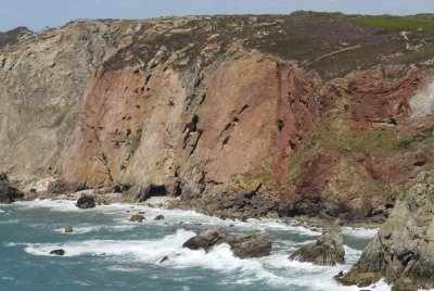cliffs on north side of Hanover cove showing modern mining operations through the metaliferous sandstones