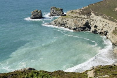 Trevellas Porth at high tide - spot the fisherman