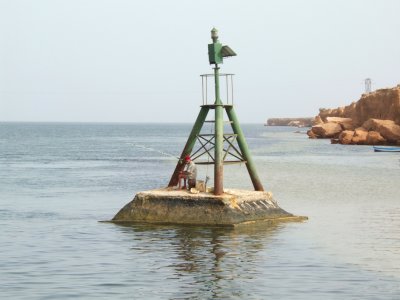 Djerba Ferry Crossing Guy Fishing Nearby.jpg
