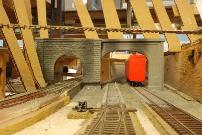 Low level view. Narrow gauge roundhouse to right with track connector above