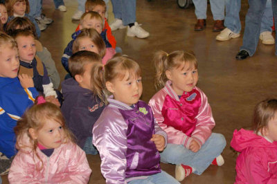 Watching the fireman dress up in his fire suit. They were a little afraid when the mask went on