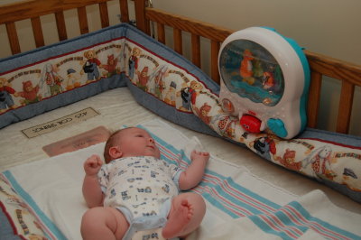 Nathan watching his crib toy