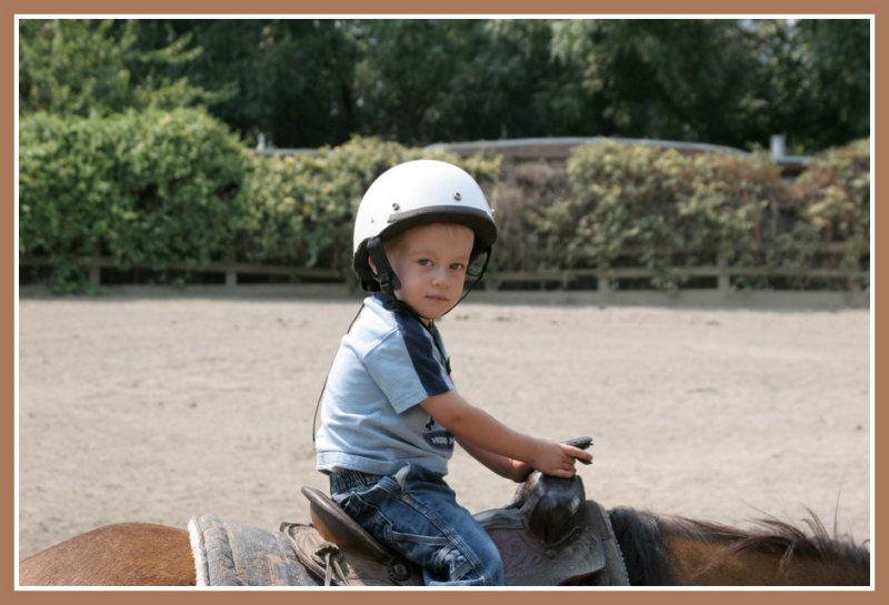 Josh riding a pony at Delaneys 3rd birthday