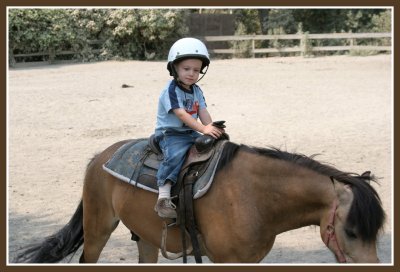 Josh riding a pony at Delaney's 3rd birthday