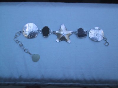 Cannon Beach bracelet - made with stones from the beach, a jade seashell, a sterling starfish, and 2 sterling sand-dollars.  All hand-made.  SOLD