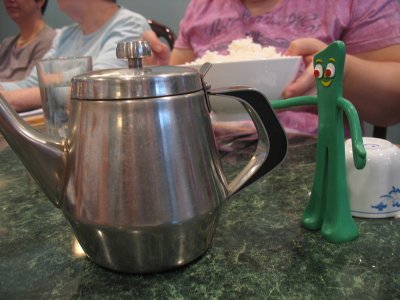 Gumby crashes the ladie's lunch out, but makes himself useful by pouring tea