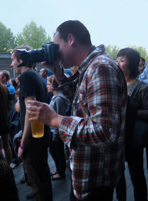 Holding a pint of a Camera