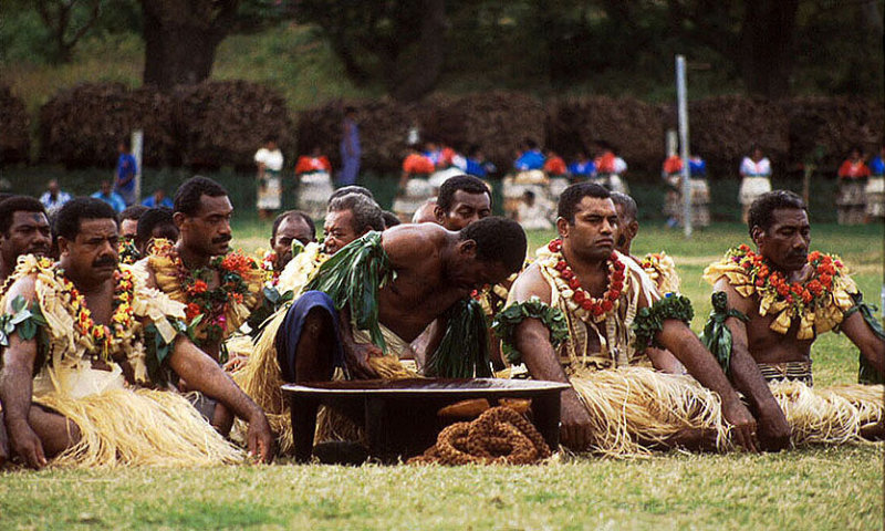 Men with a dish of yaqona, mixed from kava root