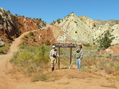 Posing by the trailhead sign