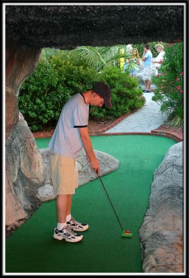 Brett putts in the cave