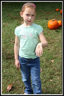 Noelle got a pumpkin on her hand (she isn't smiling in most of the pictures, because she was still sick.)