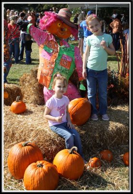 Noelle and Kylie with the scarecrow