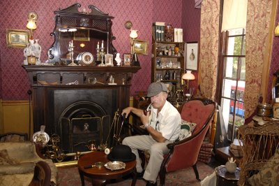 Jim, with his own Sherlock Holmes pipe, in Mr. Holmes study at 221B Baker St