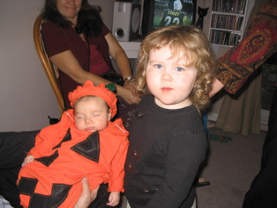Selena dressed Ella up as a pumpkin for Halloween