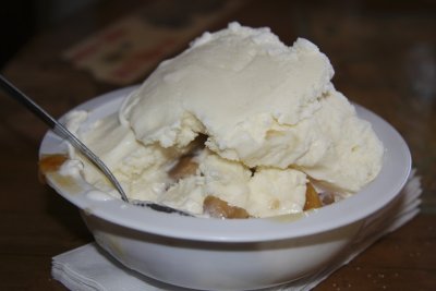 Peach cobbler with homemade vanilla ice cream