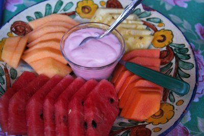 Breakfast begins with fresh cantaloupe, pineapple, papaya, watermelon and yogurt.