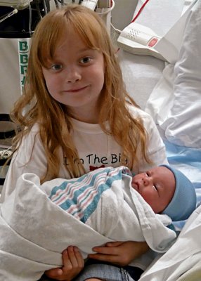 KATIE, WITH HER NEW LITTLE BROTHER
