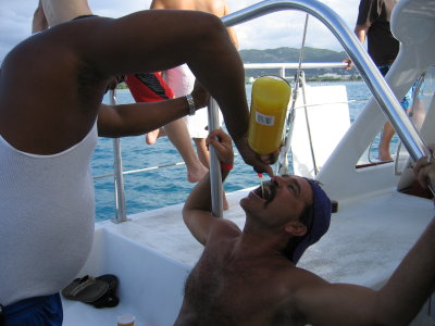 The captain giving shots on the boat - there is LSU fan Chris