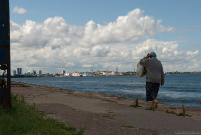 A Tallinn skyline with an elderly lady