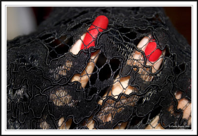 Black lace and red talons!