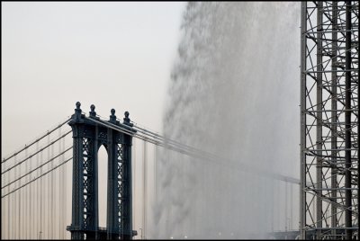 Waterfalls and Manhatan Bridge Tower Early Evening