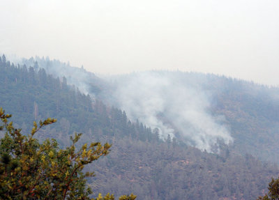 Smoke temporarily clears to reveal smoldering Feather River Canyon, just east of Magalia