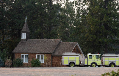 Governor's Emergency Operation Services trucks staged at the old Magalia Church