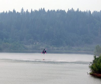 Black Hawk scoops water at Magalia Reservoir