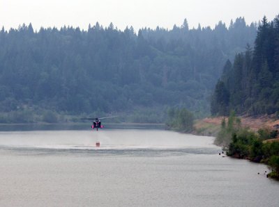 Black Hawk scoops water at Magalia Reservoir