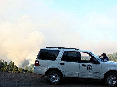 6-22: U.S. Forest Service ranger takes a look