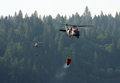 6-30: Two at a time - Chinook and Black Hawk copters approach Magalia Reservoir