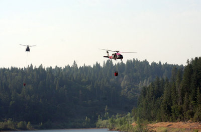 6-30: Two at a time - Chinook and Black Hawk copters approach Magalia Reservoir