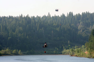 6-30: Two at a time - Chinook and Black Hawk copters fill up at Magalia Reservoir