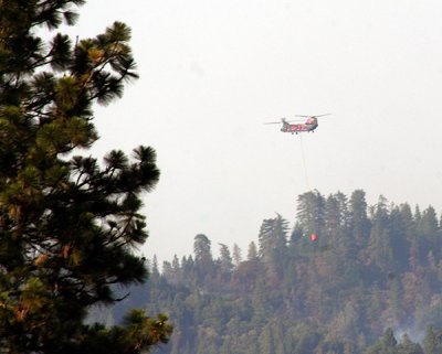 6-30: Chinook copter carrying water to the West Fire