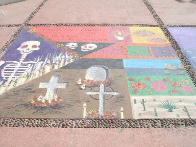 Chalk murals on the sidewalk outside the Museo