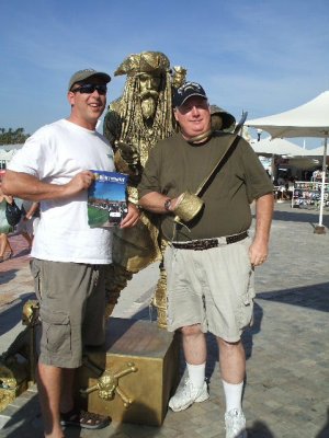 Our friend and my hubby w/ a golden pirate