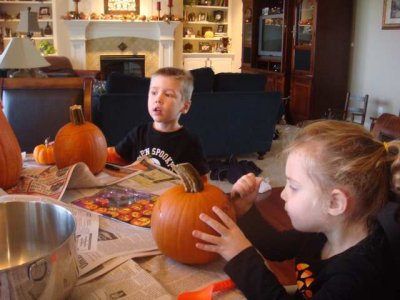 coloring their pumpkins