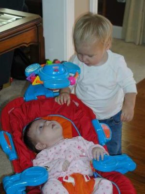 checking out baby sister