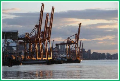 Container cranes at sunset.